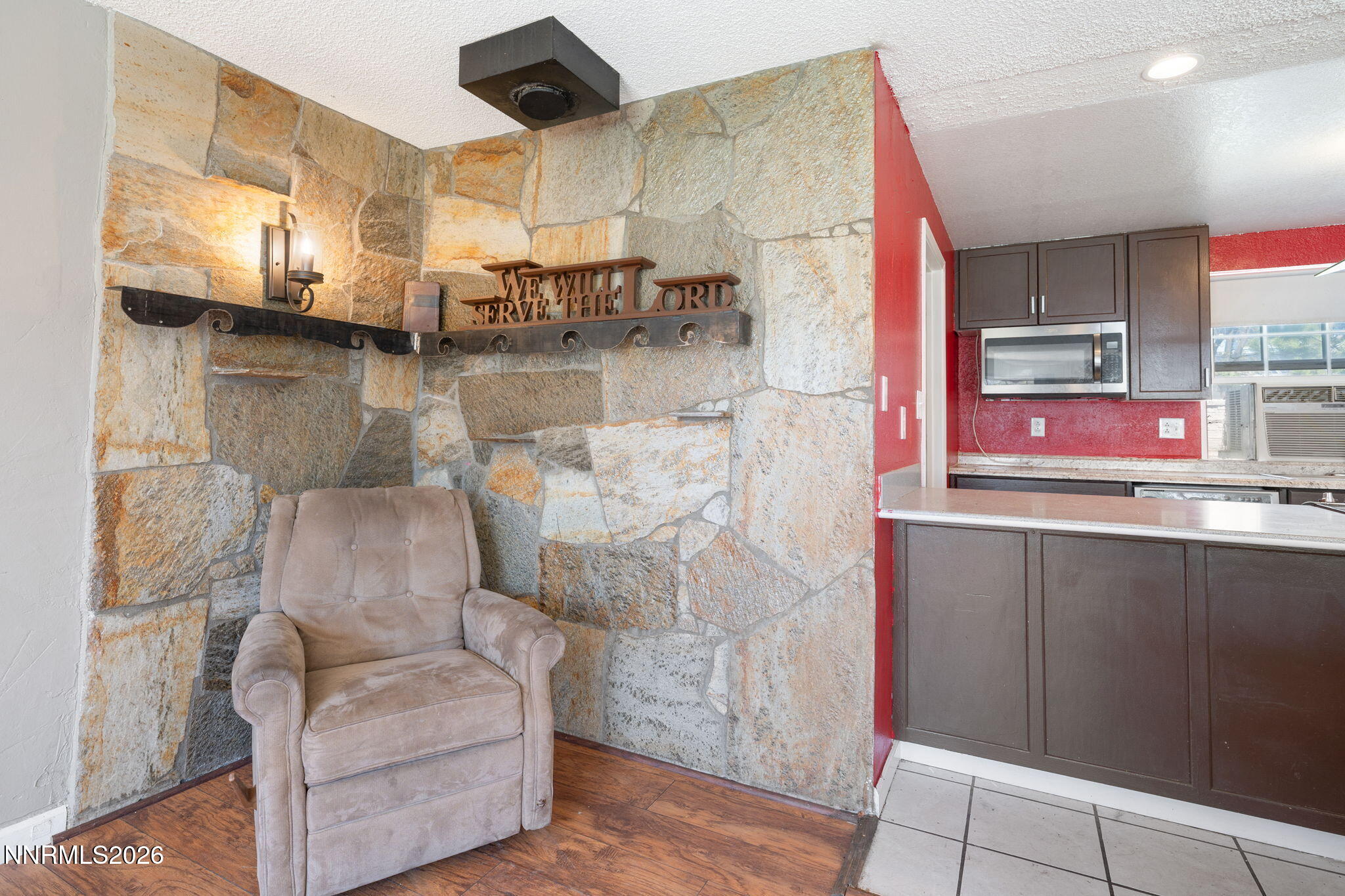3590 Siskin Lane Reno, NV 89508 - Photo 10 of 31 a kitchen with stainless steel appliances kitchen island granite countertop a table and chairs in it