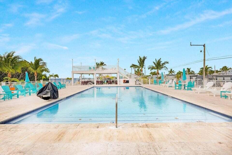 325 Calusa Street, Unit 413 Key Largo, FL 33037 - Photo 20 of 27 a view of a swimming pool
