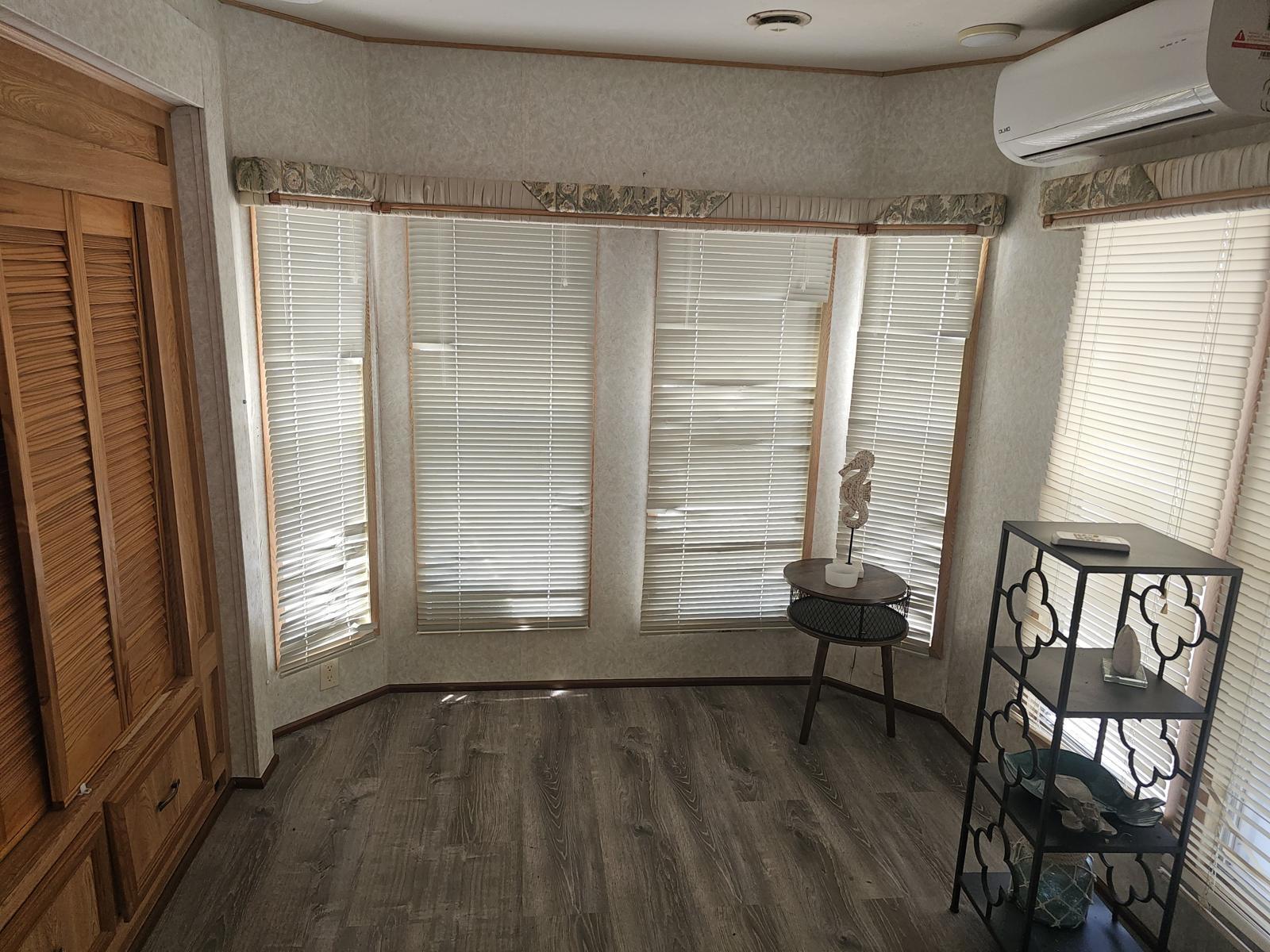 325 Calusa Street, Unit 413 Key Largo, FL 33037 - Photo 4 of 27 a view of a livingroom with furniture and windows