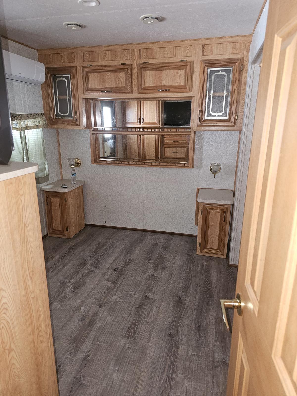 325 Calusa Street, Unit 413 Key Largo, FL 33037 - Photo 6 of 27 a view of a kitchen with furniture and wooden floor
