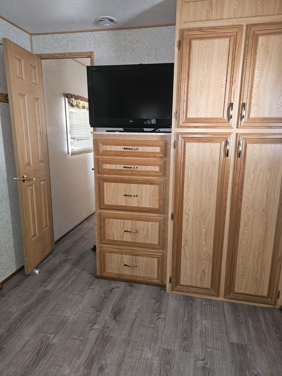 325 Calusa Street, Unit 413 Key Largo, FL 33037 - Photo 7 of 27 a view of a livingroom with wooden floor and window