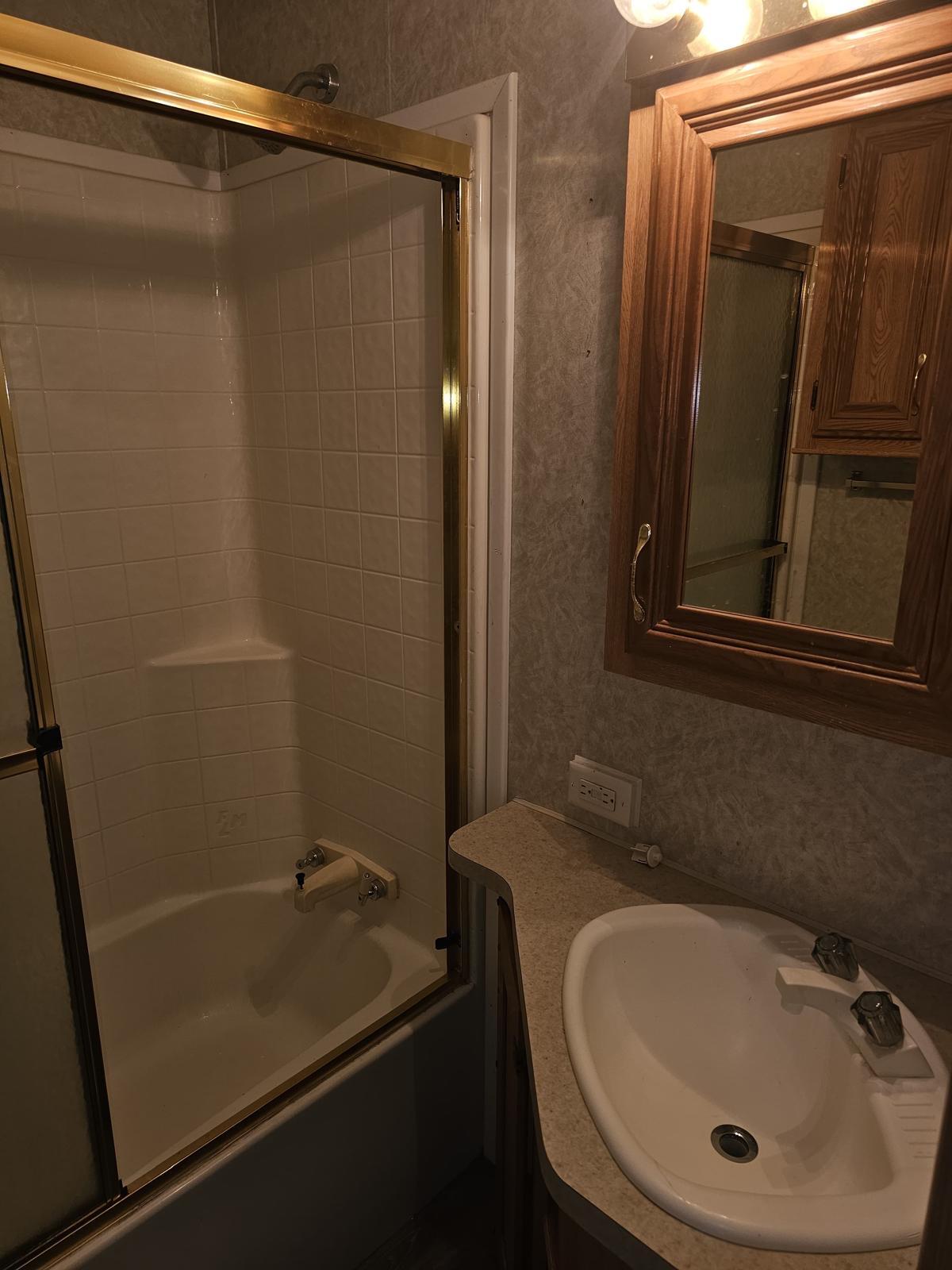 325 Calusa Street, Unit 413 Key Largo, FL 33037 - Photo 8 of 27 a bathroom with a sink and a mirror