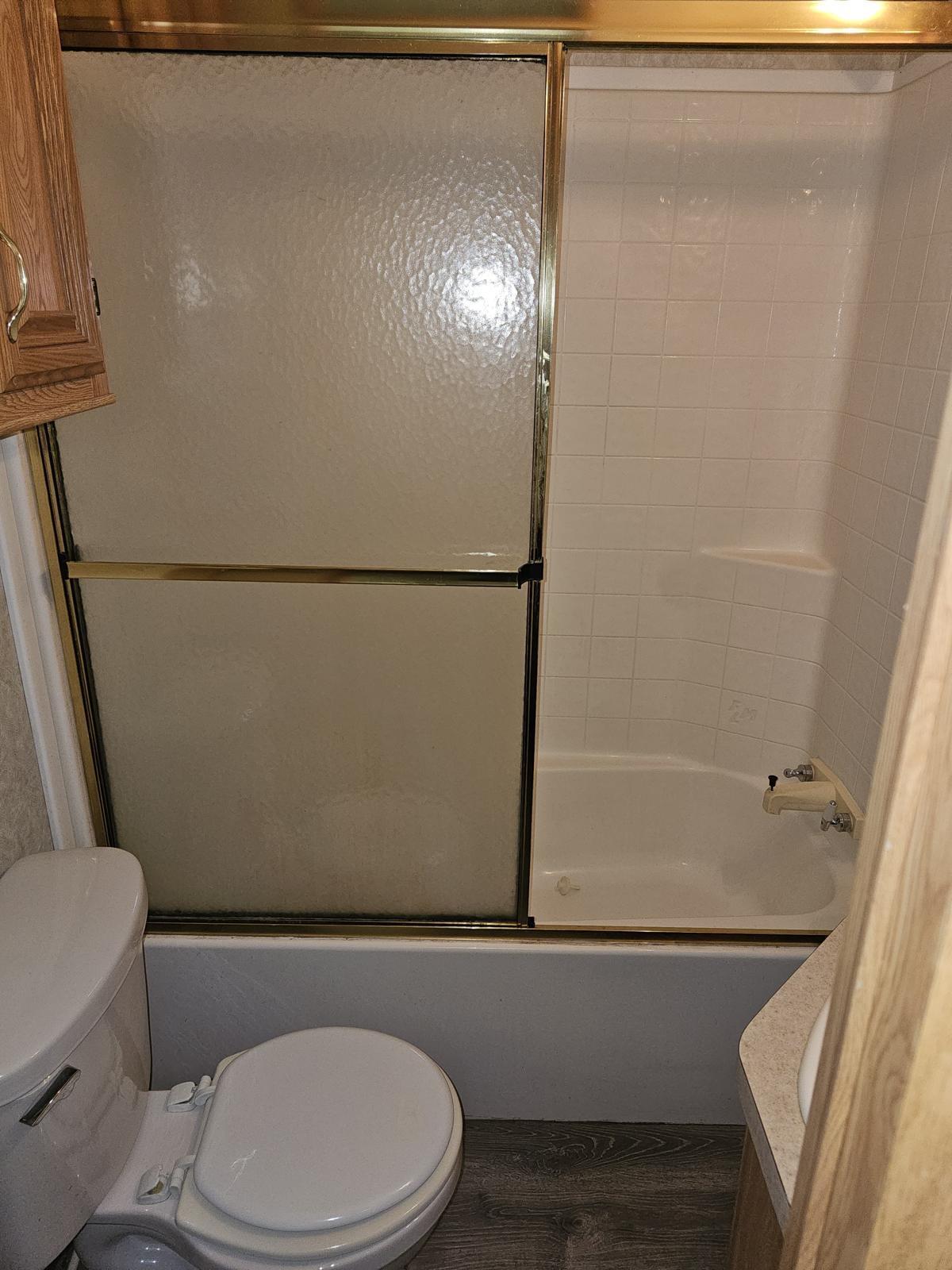 325 Calusa Street, Unit 413 Key Largo, FL 33037 - Photo 9 of 27 a bathroom with a toilet and a shower