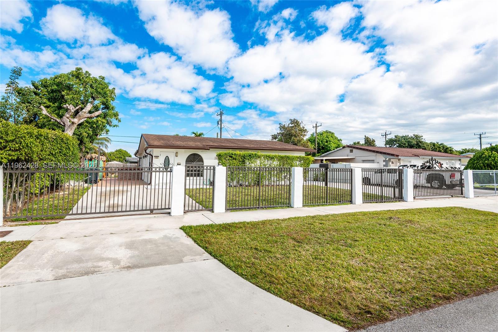 11941 Southwest 178th Terrace Miami, FL 33177 - Photo 2 of 33 a view of a house with garden
