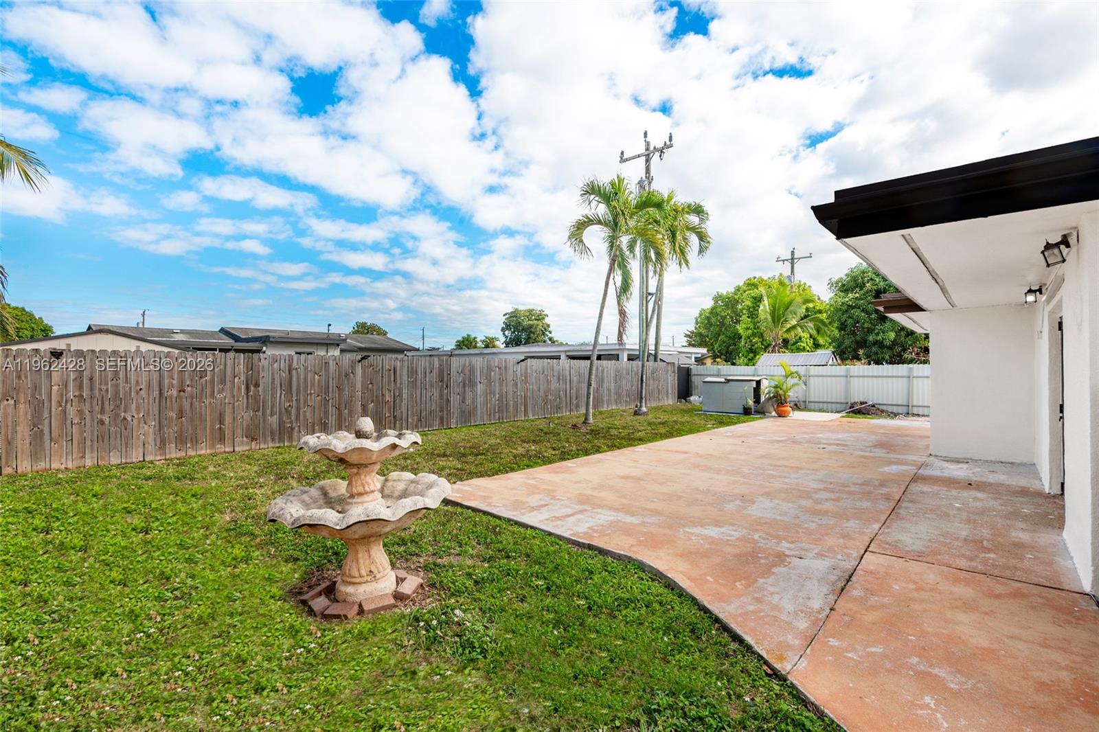 11941 Southwest 178th Terrace Miami, FL 33177 - Photo 30 of 33 a garden view with a seating space