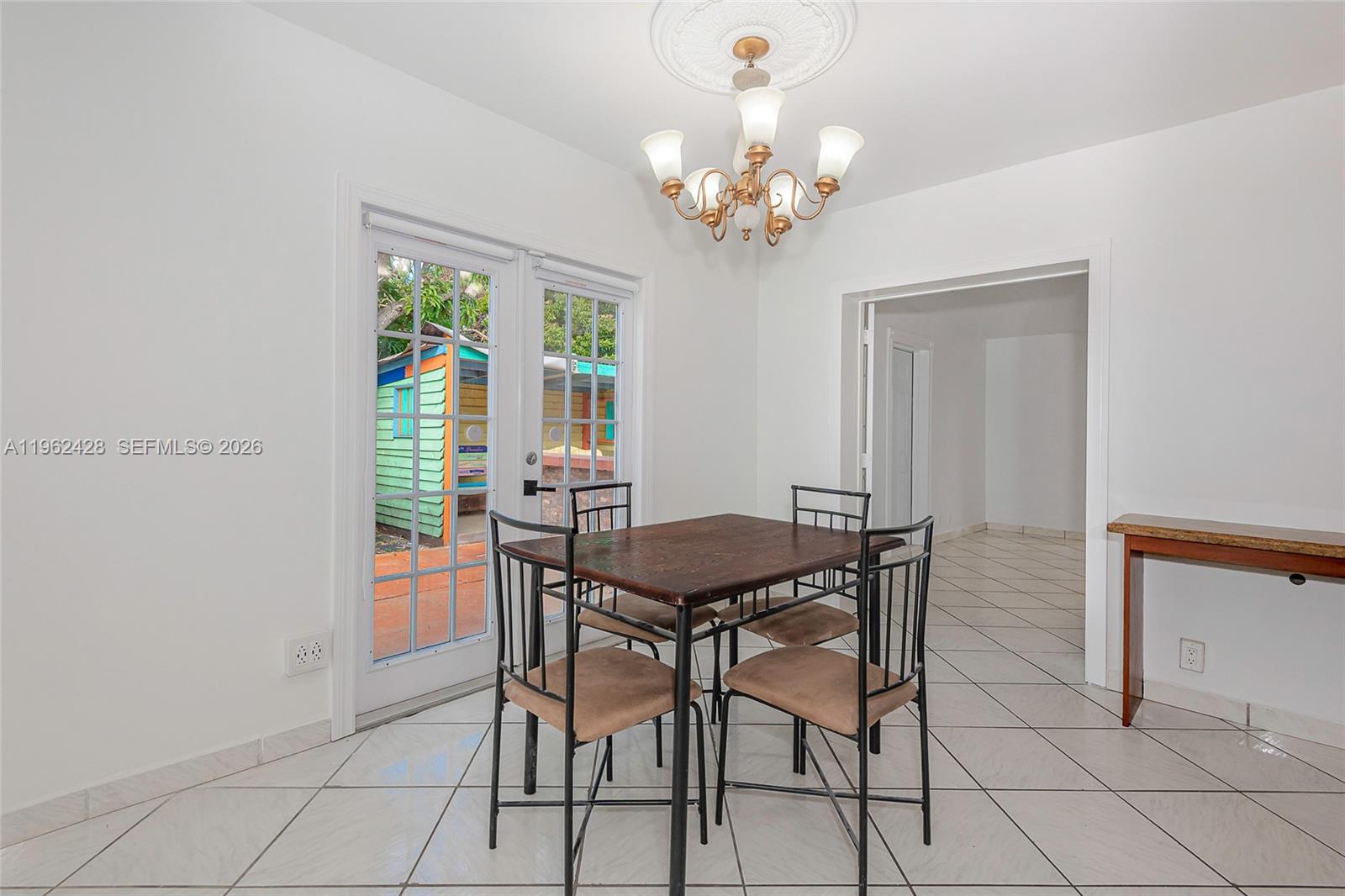 11941 Southwest 178th Terrace Miami, FL 33177 - Photo 8 of 33 a view of a dining room with furniture and a chandelier