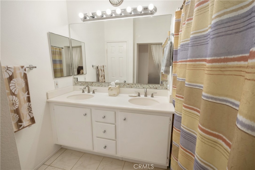 1517 Ismail Place Placentia, CA 92870 - Photo 13 of 28 a bathroom with a sink and a mirror