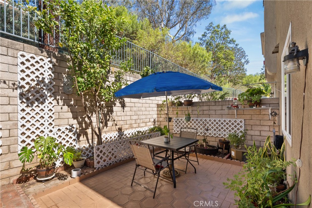 1517 Ismail Place Placentia, CA 92870 - Photo 18 of 28 a patio with tables and chairs