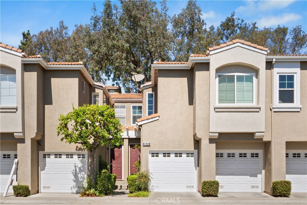 1517 Ismail Place Placentia, CA 92870 - Photo 2 of 28 a front view of a house with a garden