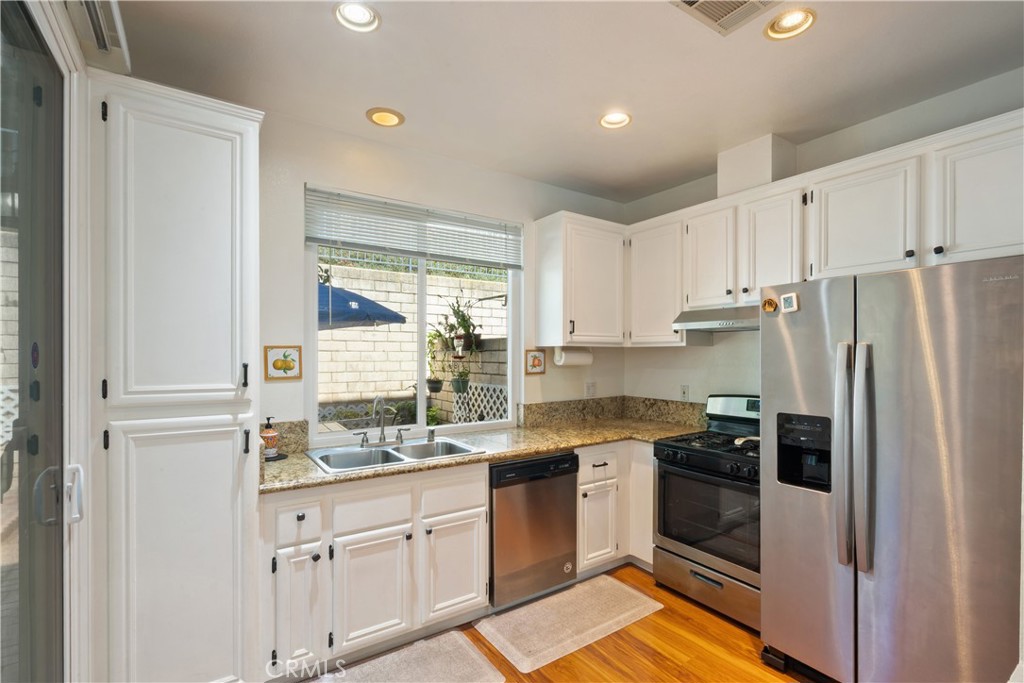1517 Ismail Place Placentia, CA 92870 - Photo 9 of 28 a kitchen with a sink stove and refrigerator