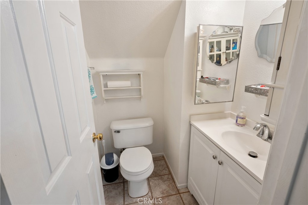 1517 Ismail Place Placentia, CA 92870 - Photo 10 of 28 a white toilet sitting next to a bathroom sink