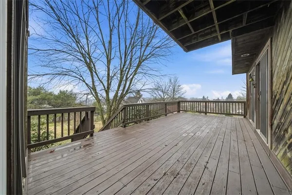a view of balcony with wooden floor