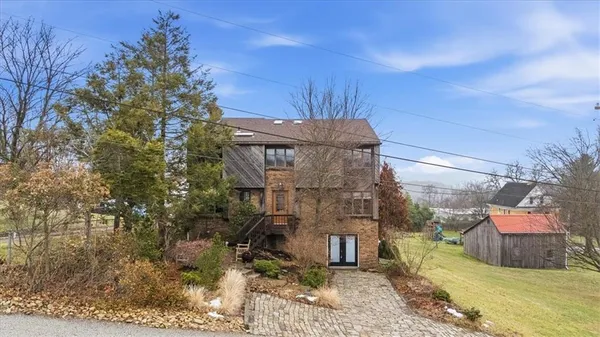 a brick building with a yard