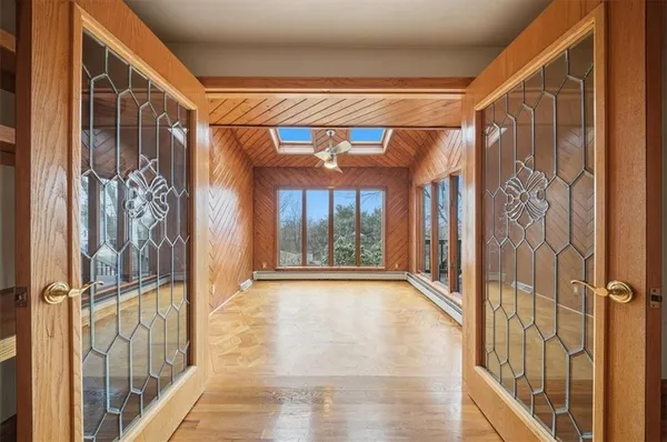 a view of an empty room with a window