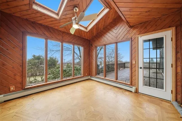 a view of empty room with floor to ceiling windows
