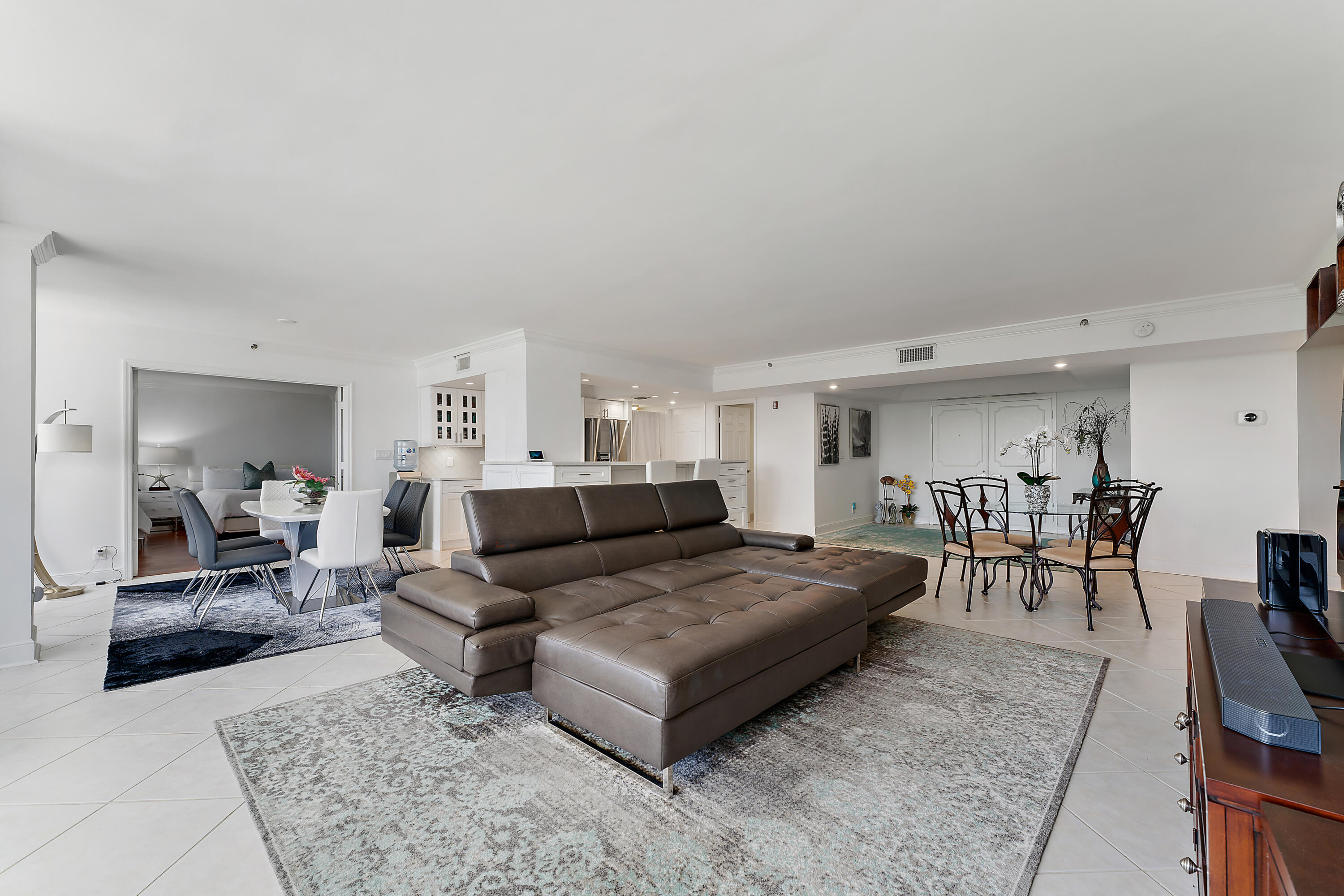 5280 North Ocean Drive, Unit 2F Singer Island, FL 33404 - Photo 12 of 92 a living room with furniture and a table