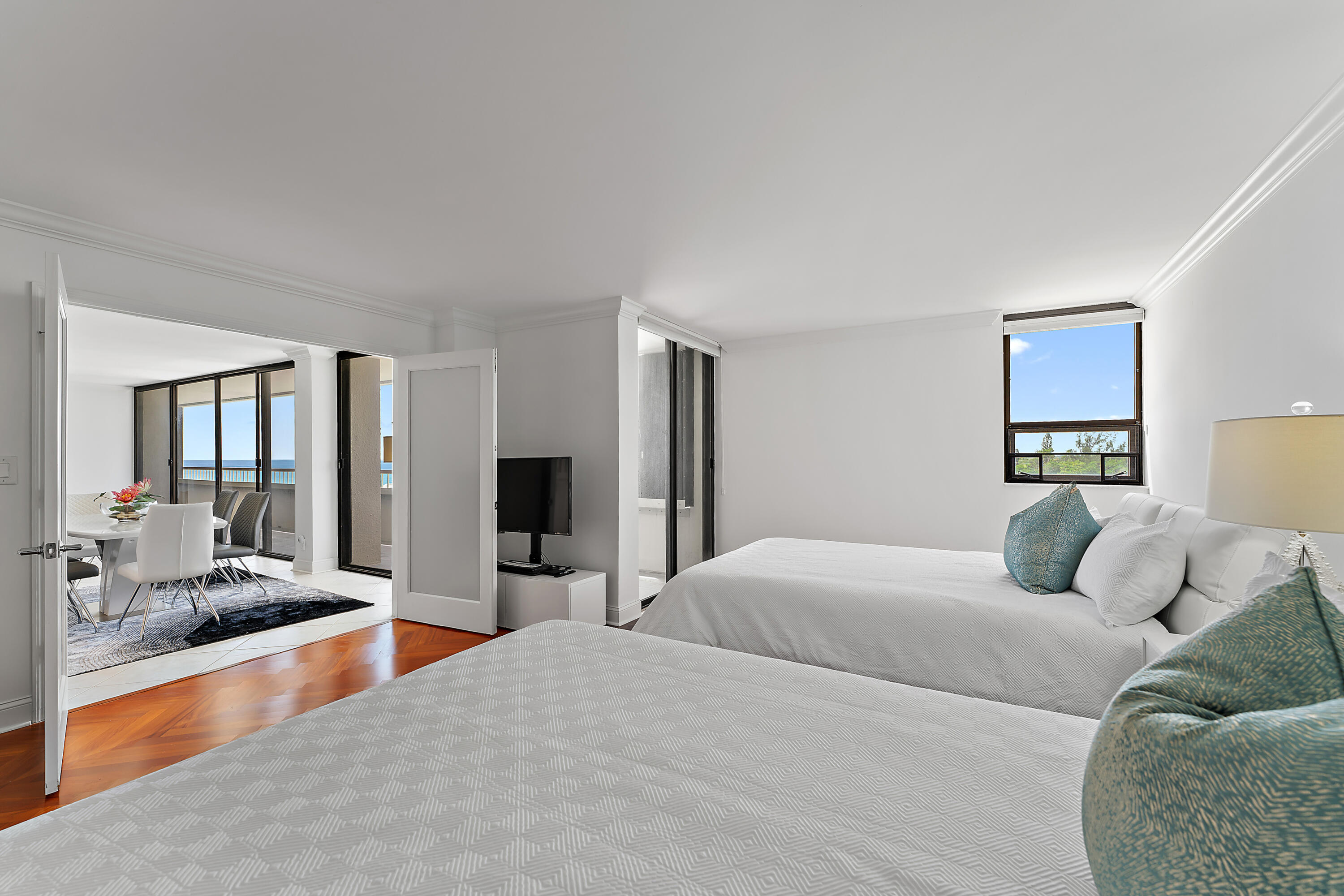 5280 North Ocean Drive, Unit 2F Singer Island, FL 33404 - Photo 27 of 92 a bedroom with a large bed and a couch