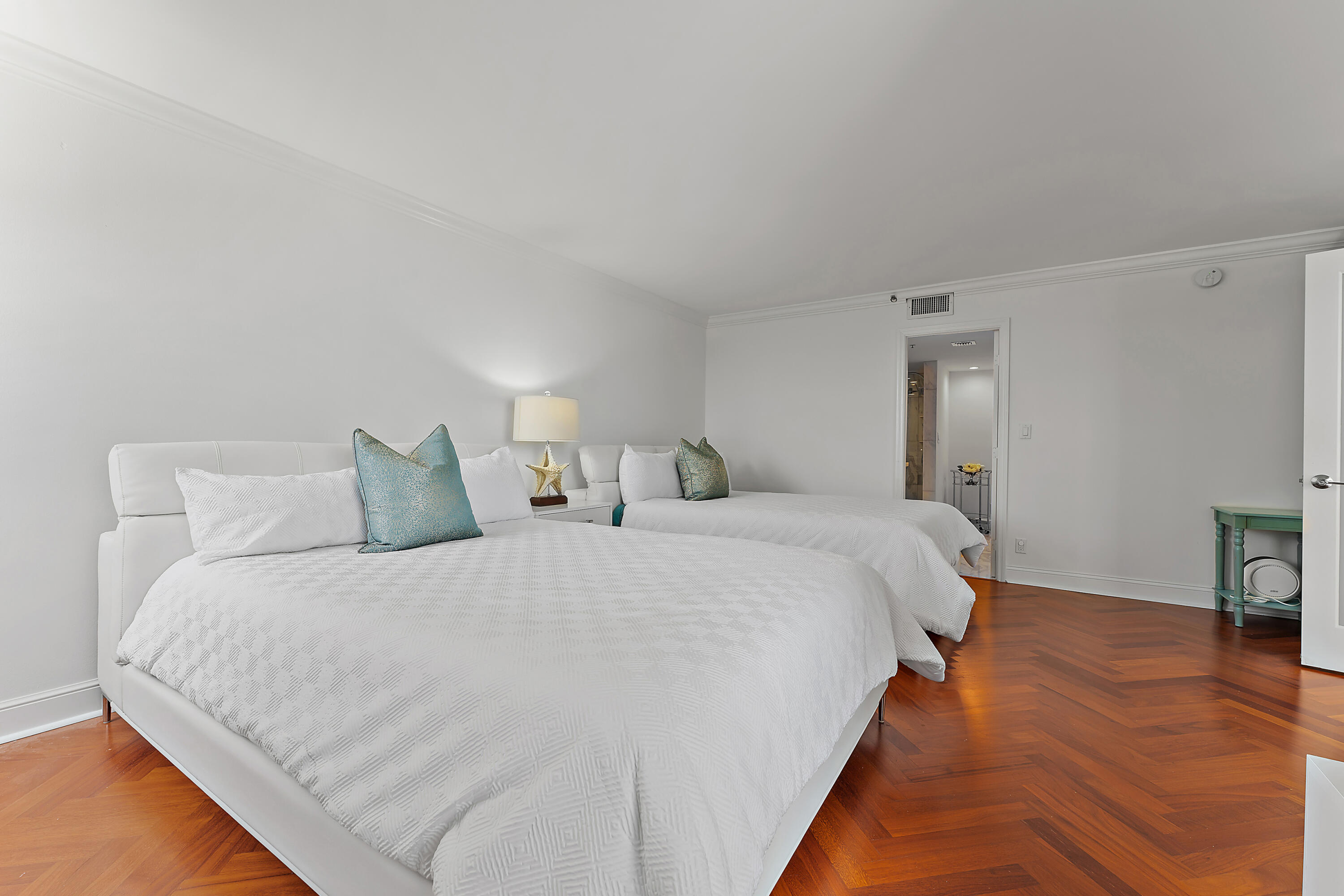 5280 North Ocean Drive, Unit 2F Singer Island, FL 33404 - Photo 28 of 92 a bed room with a bed and a chair