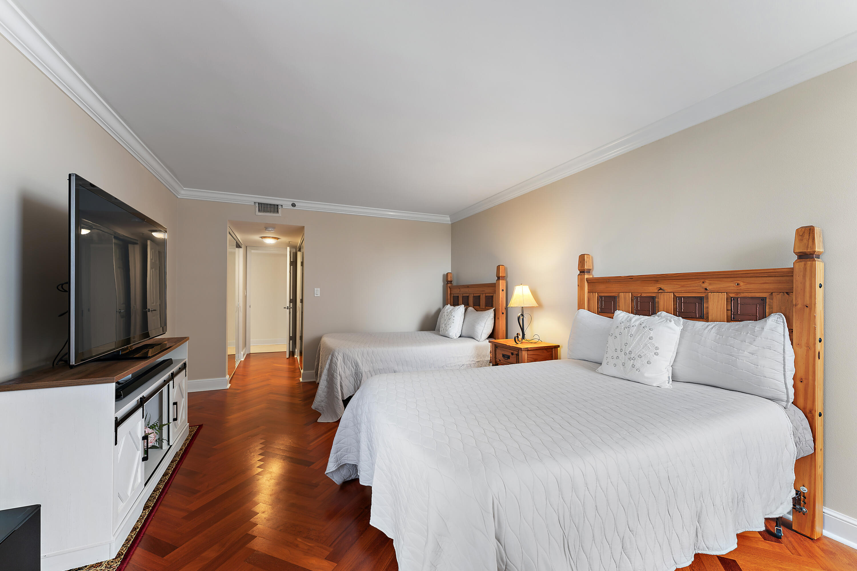 5280 North Ocean Drive, Unit 2F Singer Island, FL 33404 - Photo 33 of 92 a bedroom with bed and a flat screen tv