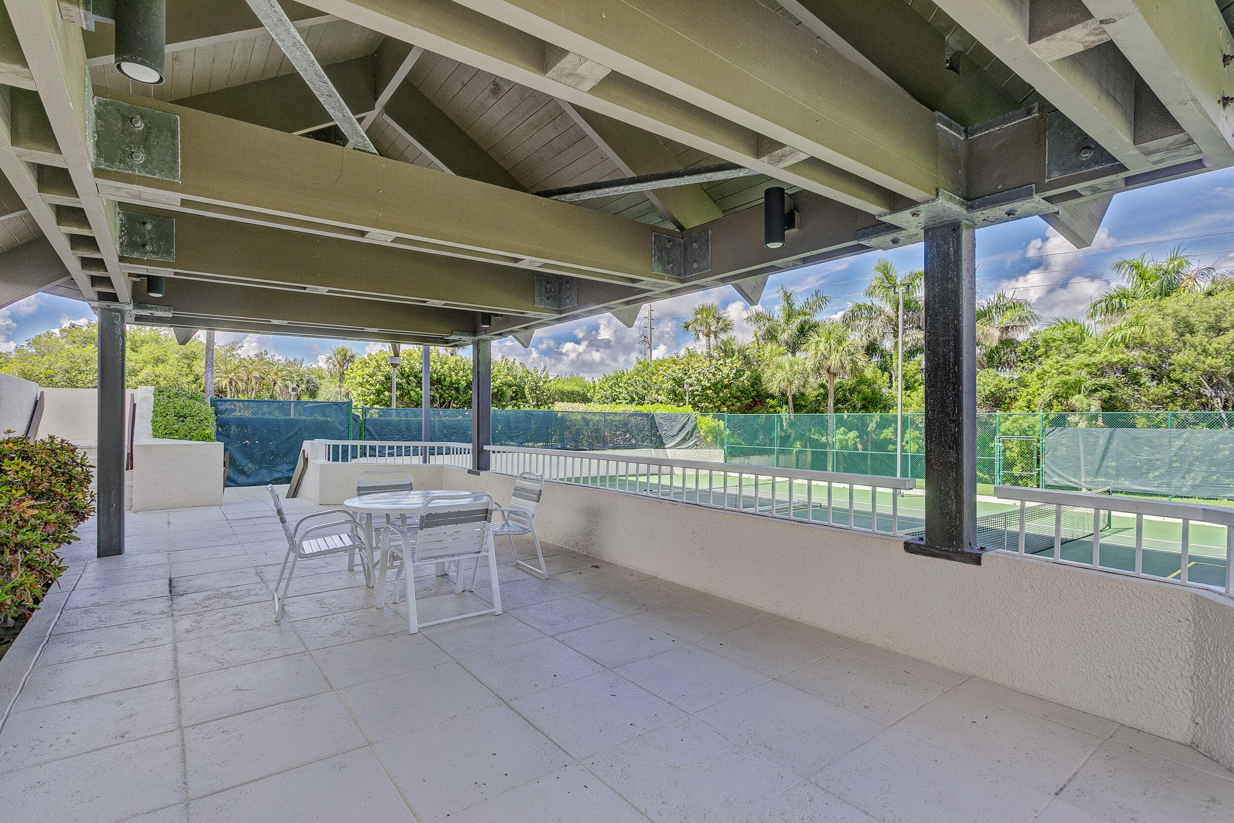 5280 North Ocean Drive, Unit 2F Singer Island, FL 33404 - Photo 67 of 92 a view of a porch with chairs and backyard