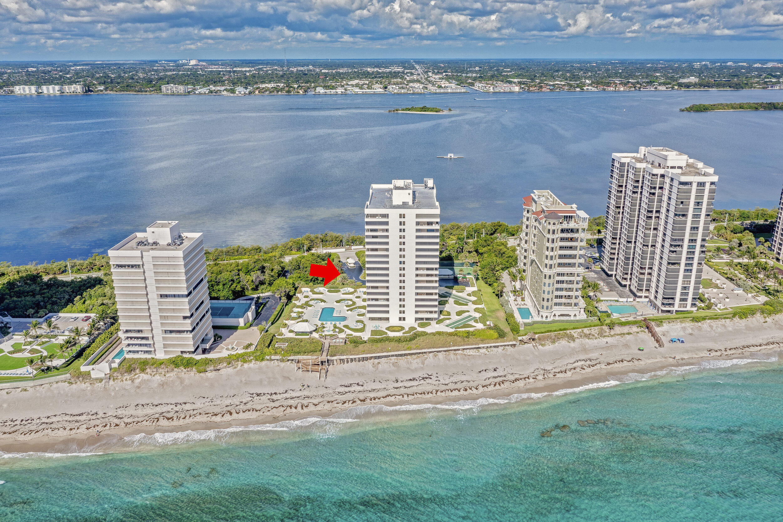 5280 North Ocean Drive, Unit 2F Singer Island, FL 33404 - Photo 81 of 92 an aerial view of a house with a yard and lake view