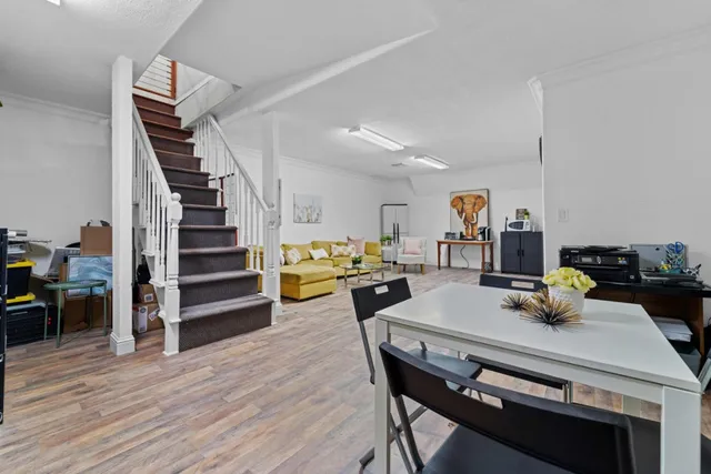 a view of a livingroom with furniture and wooden floor