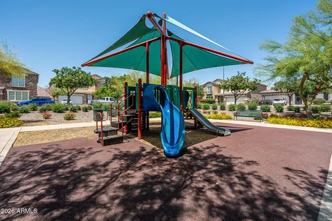 a swimming pool with outdoor seating and yard