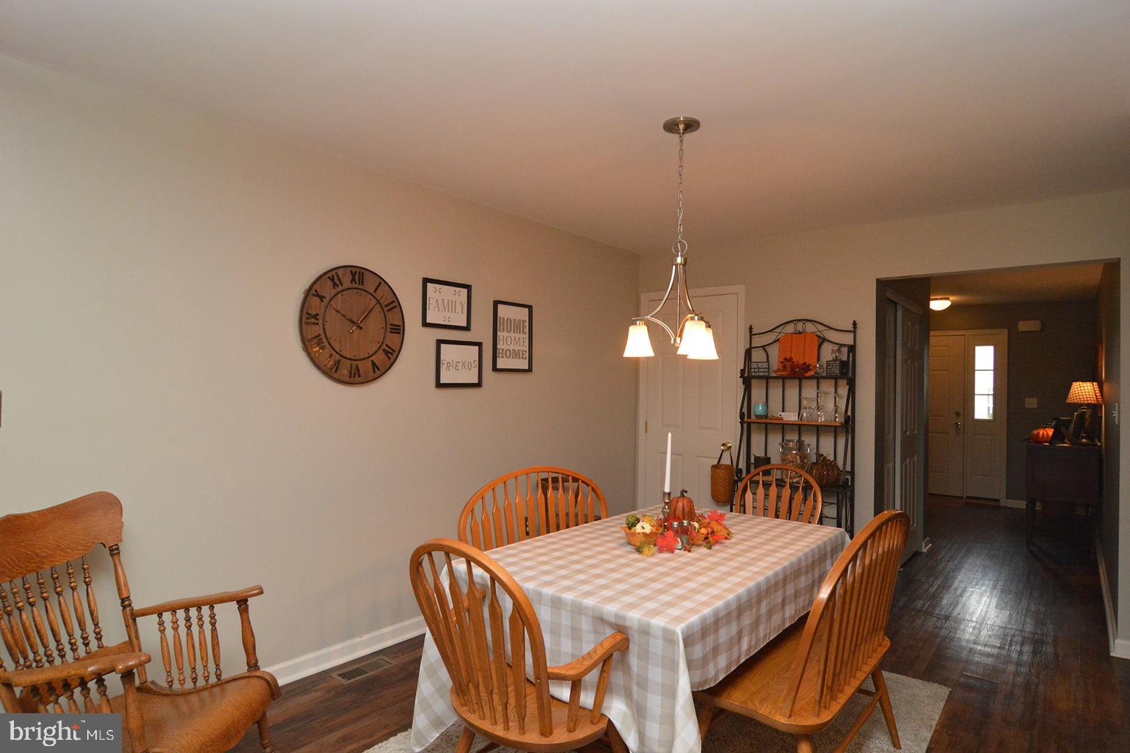 705 Caramist Circle Sinking Spring, PA 19608 - Photo 11 of 54 a dining room with furniture and a chandelier