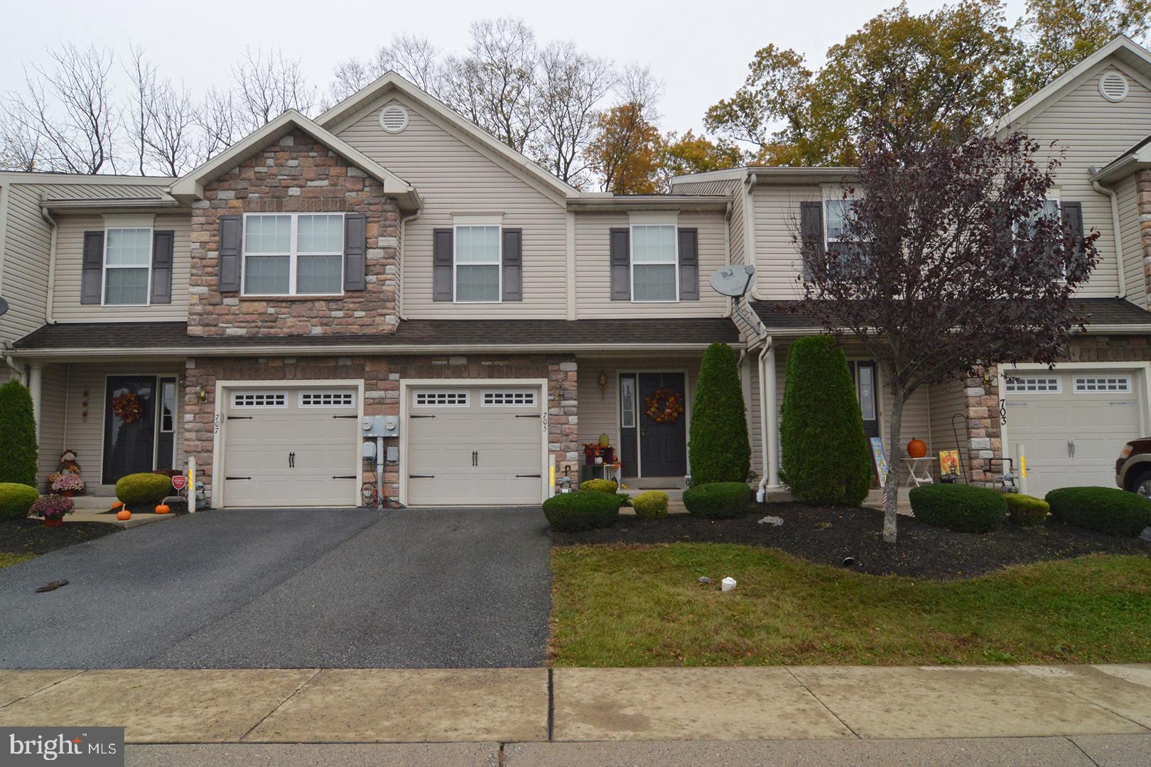 705 Caramist Circle Sinking Spring, PA 19608 - Photo 3 of 54 a front view of a house with a yard