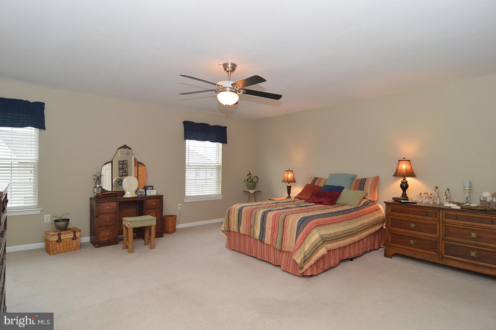 705 Caramist Circle Sinking Spring, PA 19608 - Photo 25 of 54 a bedroom with a bed and a chair