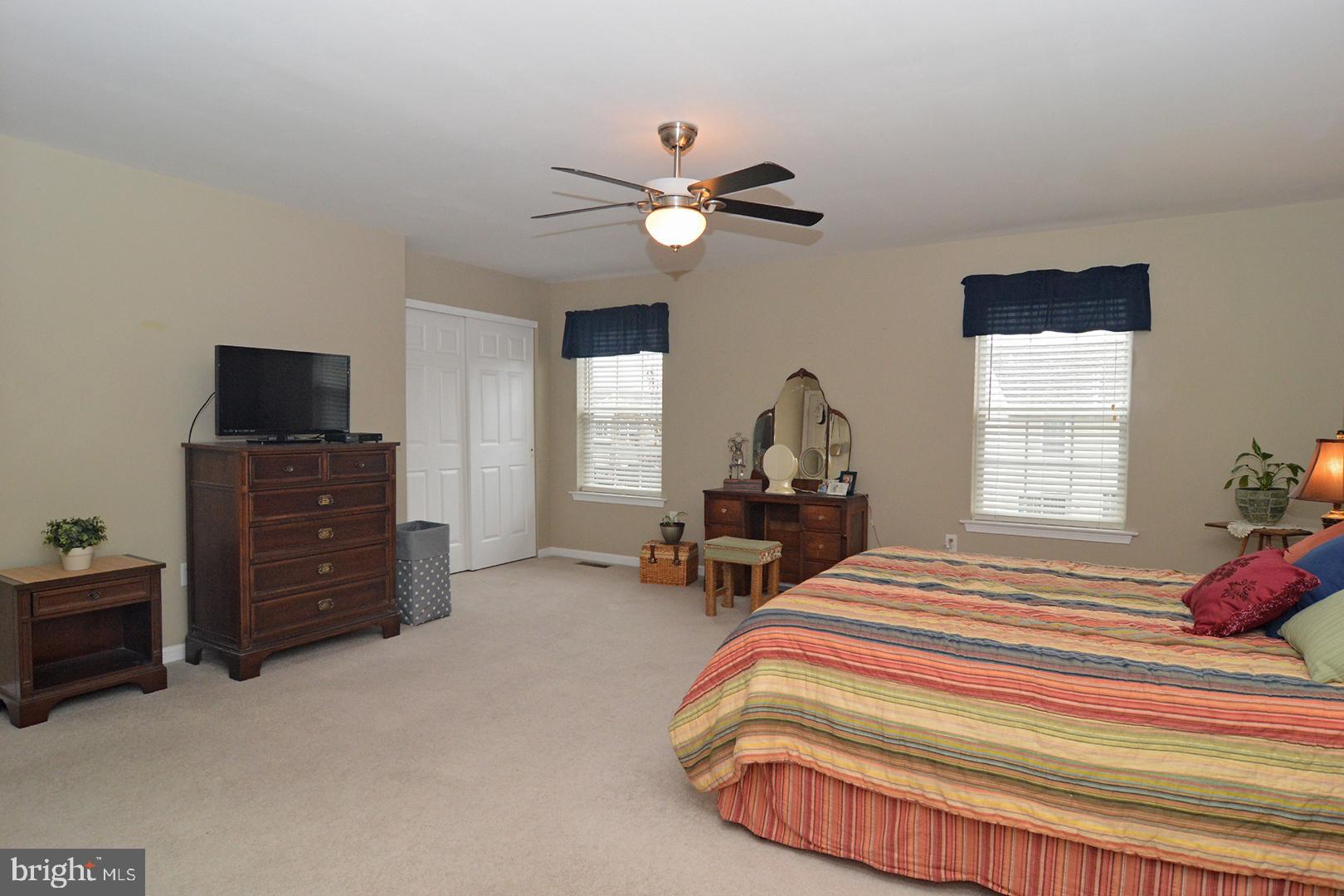 705 Caramist Circle Sinking Spring, PA 19608 - Photo 26 of 54 a bedroom with bed and a flat tv screen on dresser
