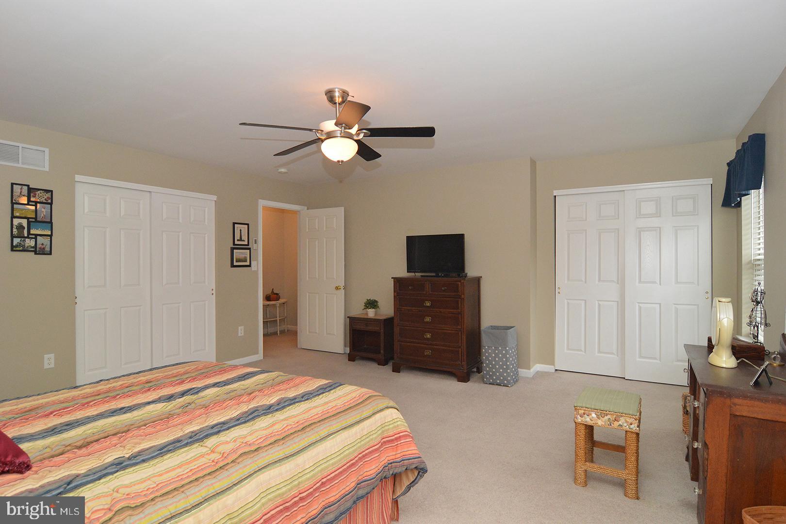 705 Caramist Circle Sinking Spring, PA 19608 - Photo 28 of 54 a bedroom with a bed and a flat screen tv