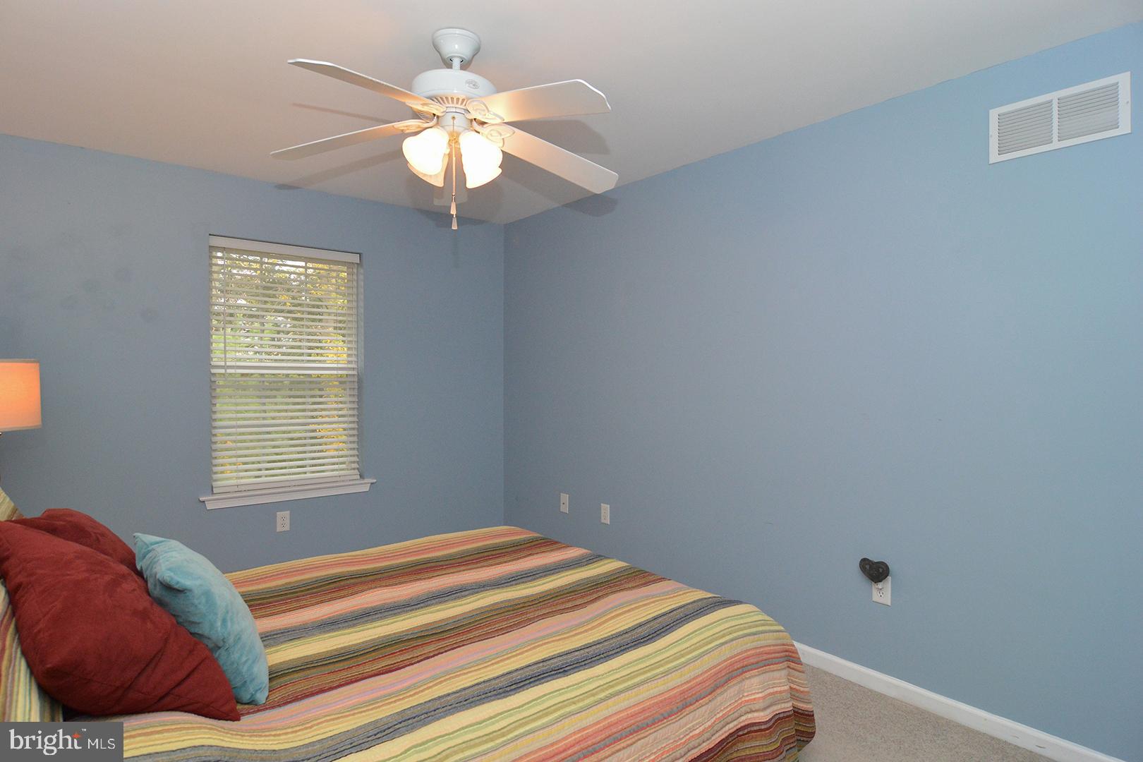 705 Caramist Circle Sinking Spring, PA 19608 - Photo 35 of 54 a bedroom with a bed and a chandelier