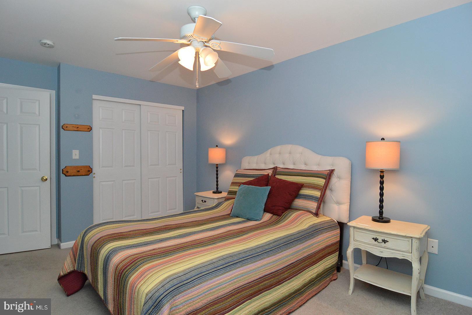 705 Caramist Circle Sinking Spring, PA 19608 - Photo 36 of 54 a bedroom with bed and a lamp