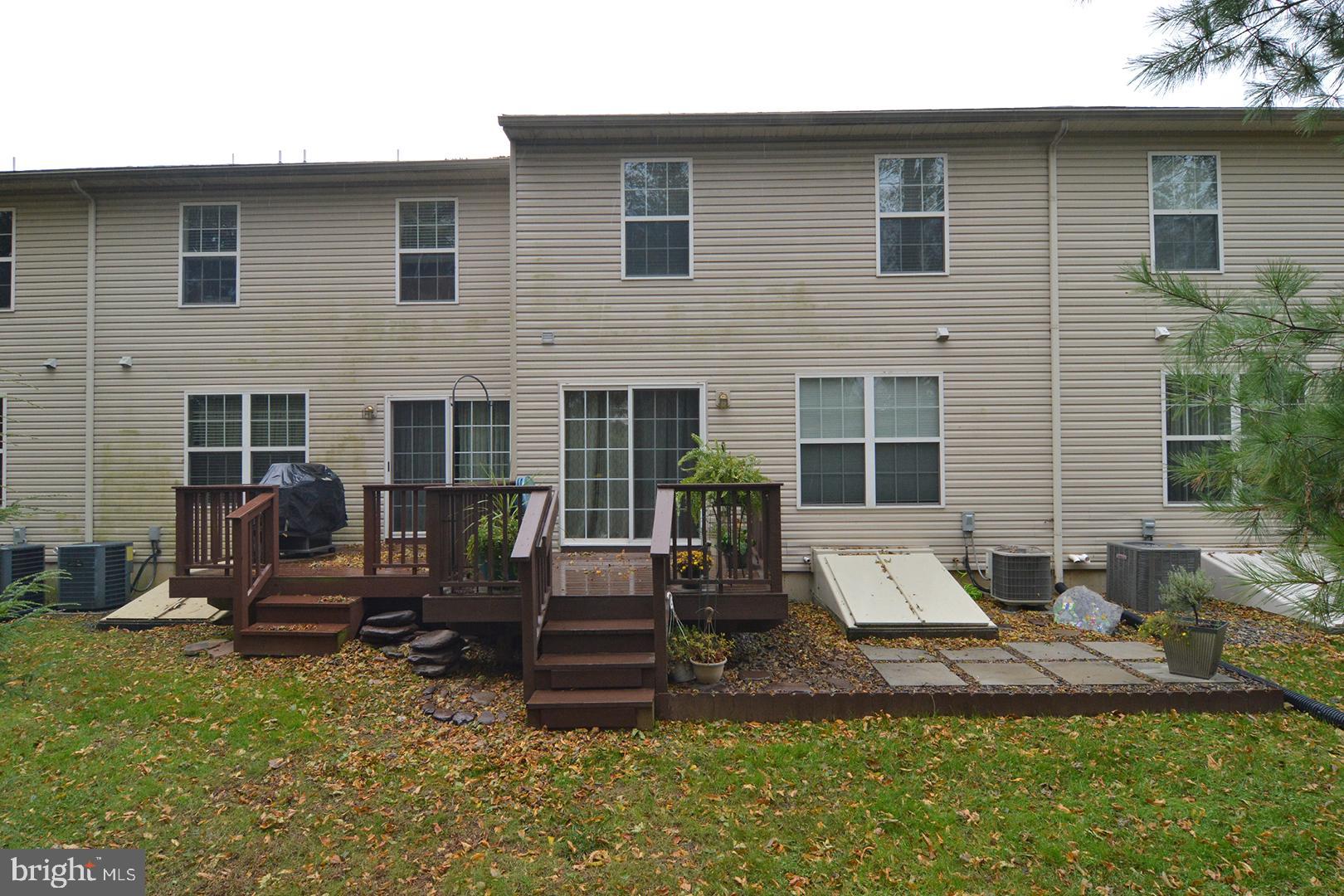 705 Caramist Circle Sinking Spring, PA 19608 - Photo 50 of 54 a view of a house with backyard sitting area and furniture