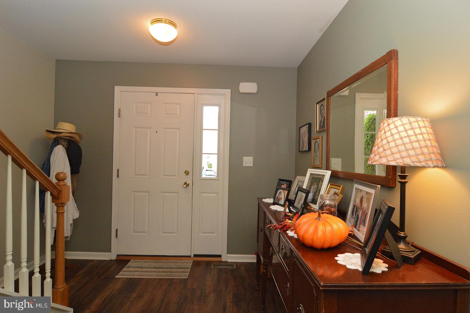 705 Caramist Circle Sinking Spring, PA 19608 - Photo 6 of 54 a view of living room with furniture and wooden floor