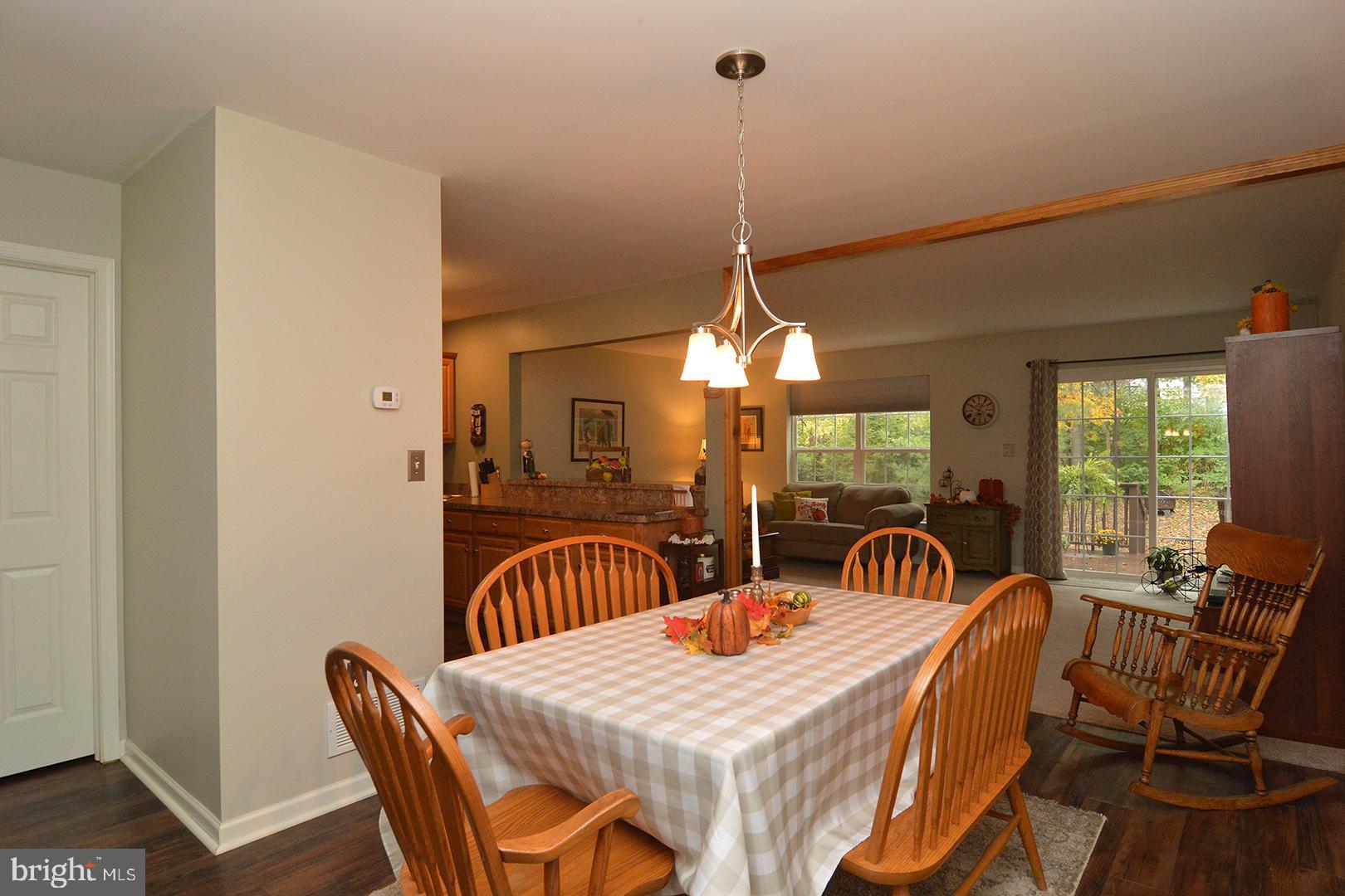 705 Caramist Circle Sinking Spring, PA 19608 - Photo 9 of 54 a view of a dining room with furniture window and outside view