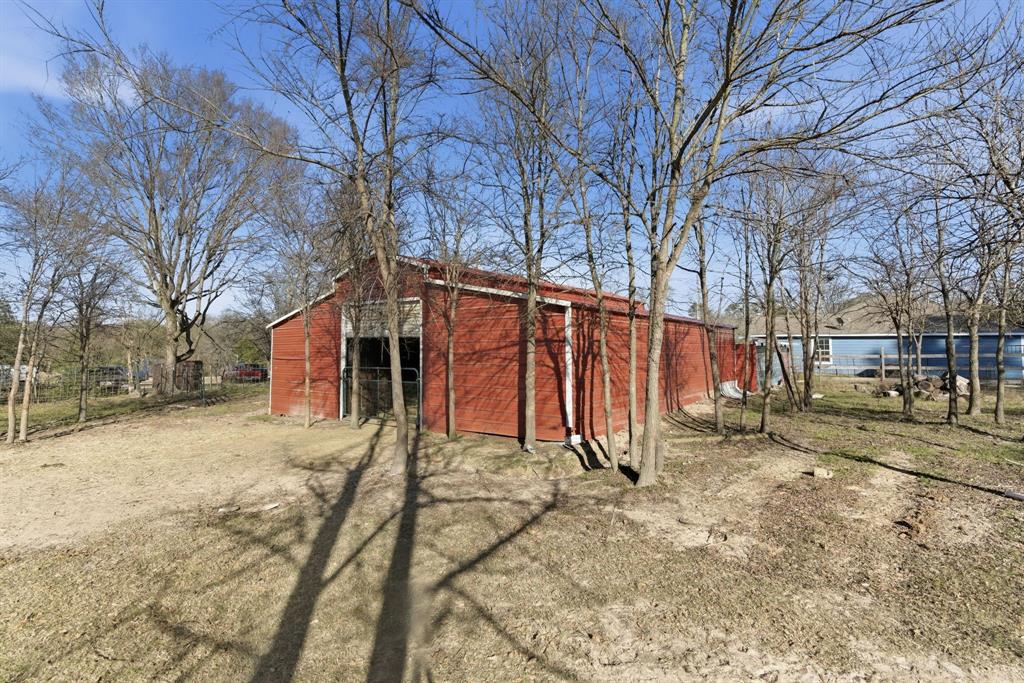 8261 County Road 381 Tyler, TX 75708 - Photo 11 of 40 a view of a house with a yard covered in snow