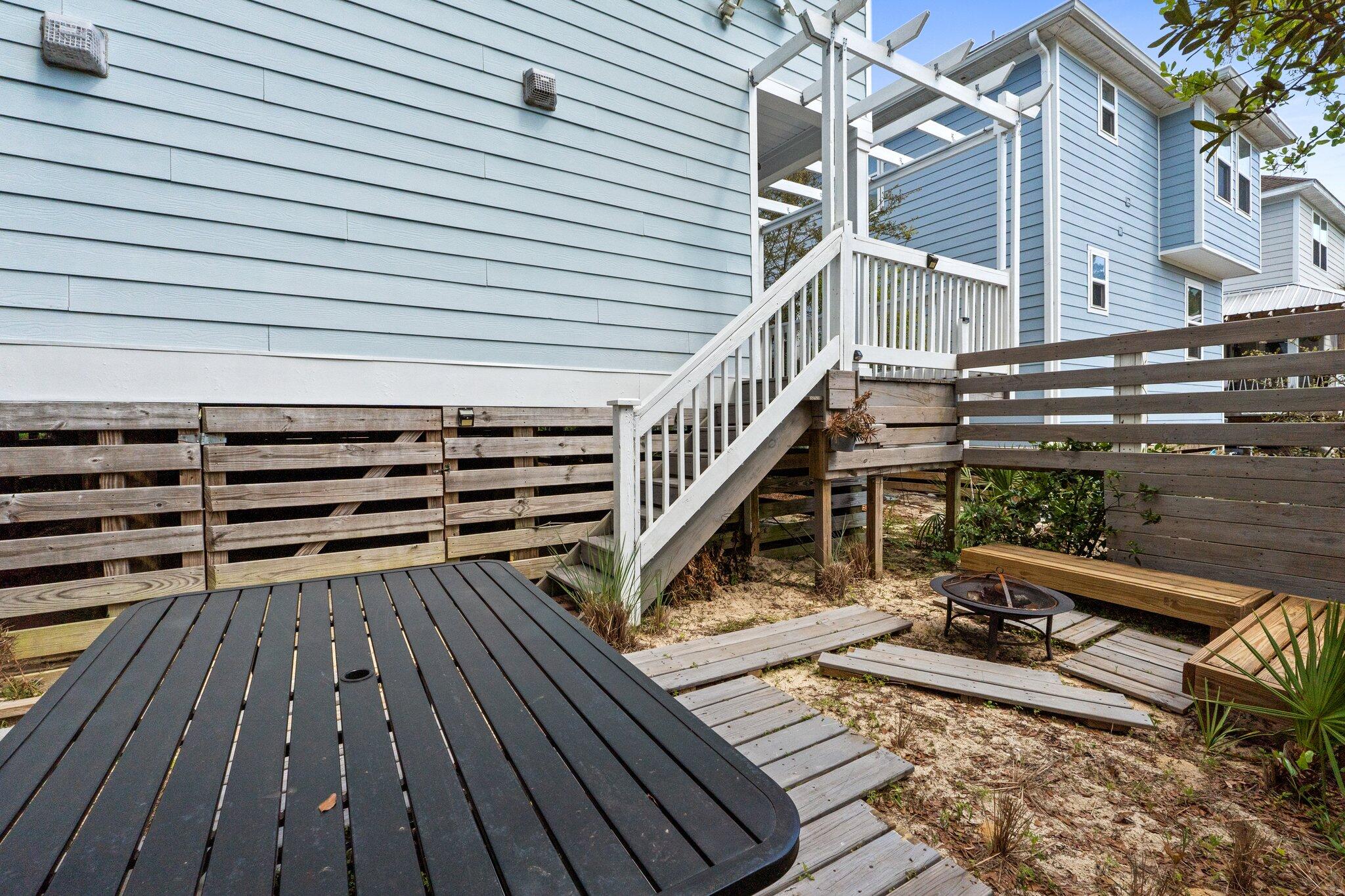 96 Sandpine Loop Inlet Beach, FL 32461 - Photo 18 of 38 a view of a roof deck with wooden floor and fence