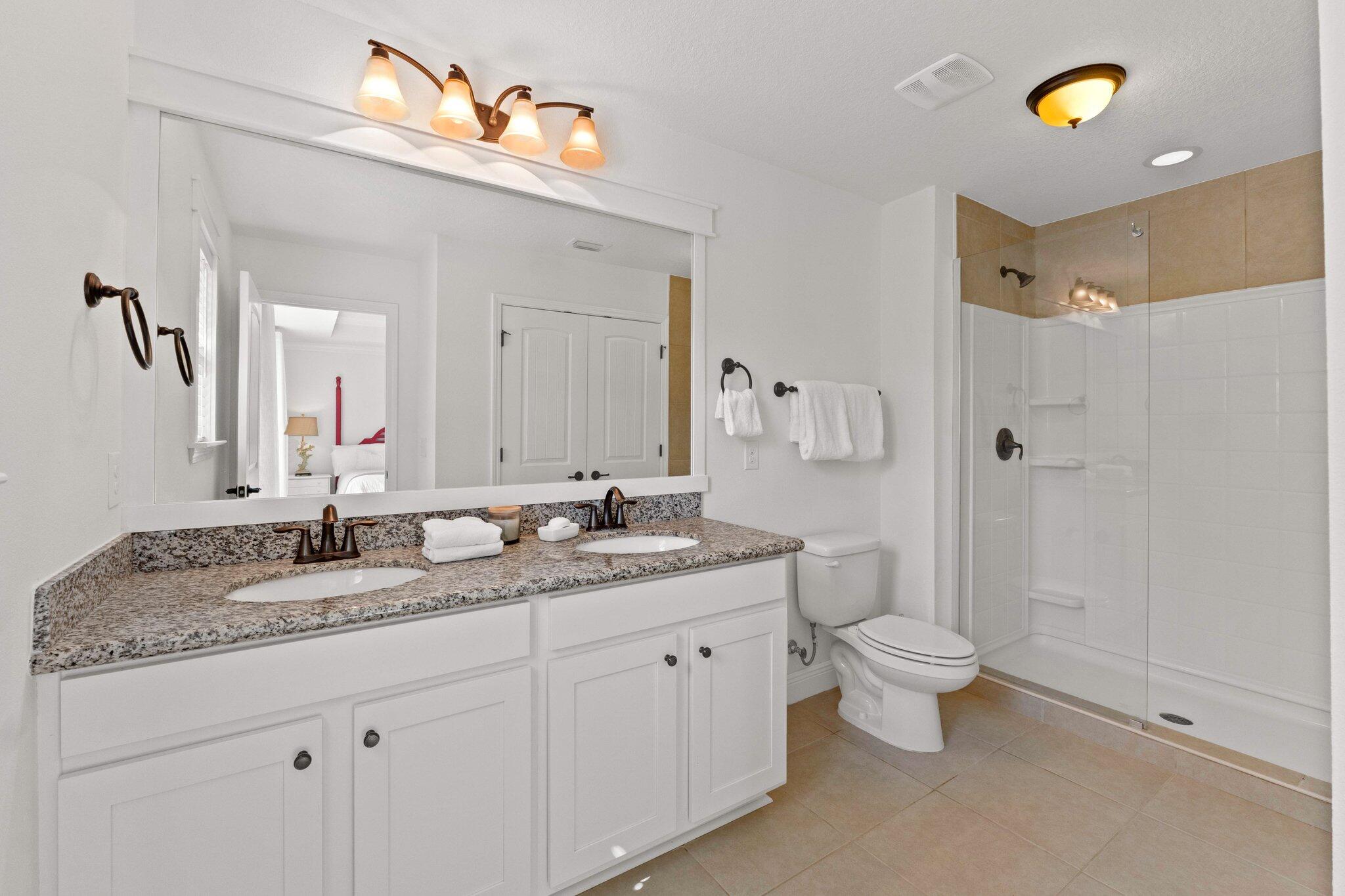 96 Sandpine Loop Inlet Beach, FL 32461 - Photo 26 of 38 a bathroom with a granite countertop sink a toilet and a mirror