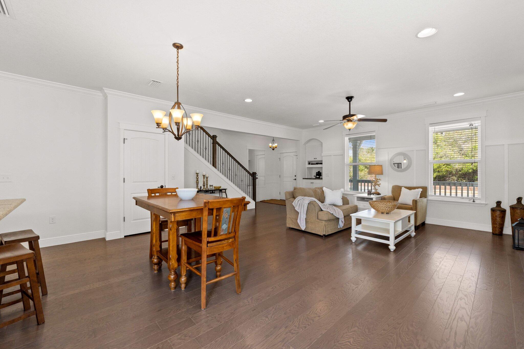 96 Sandpine Loop Inlet Beach, FL 32461 - Photo 10 of 38 a living room with furniture a dining table and a chandelier