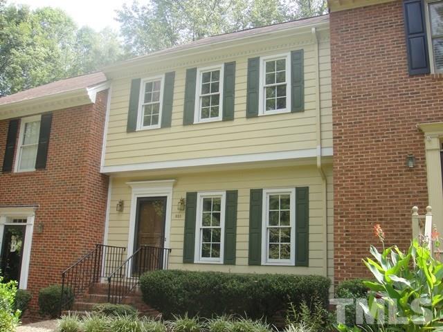 550 Weathergreen Drive Raleigh, NC 27615 - Photo 2 of 25 a view of a brick house with a large windows and plants