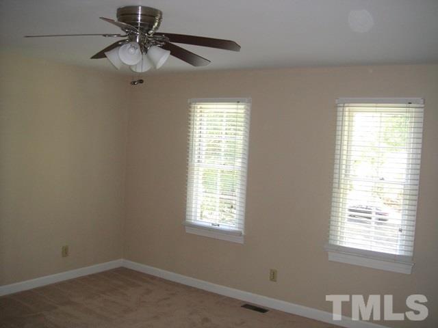 550 Weathergreen Drive Raleigh, NC 27615 - Photo 11 of 25 a view of a workspace with a window and a ceiling fan