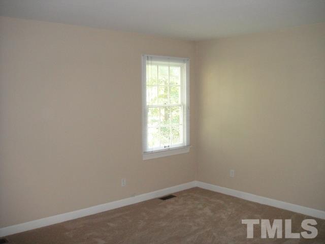 550 Weathergreen Drive Raleigh, NC 27615 - Photo 15 of 25 an empty room with a window