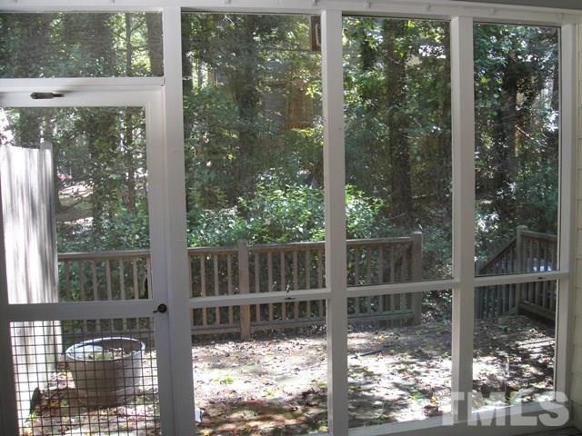 550 Weathergreen Drive Raleigh, NC 27615 - Photo 20 of 25 a view of a glass door and a yard from a window