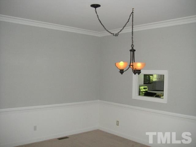 550 Weathergreen Drive Raleigh, NC 27615 - Photo 4 of 25 a bathroom with a light fixture and a window