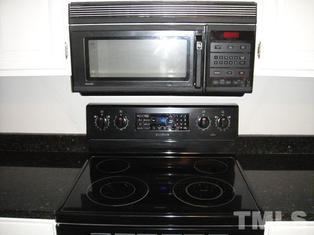 550 Weathergreen Drive Raleigh, NC 27615 - Photo 7 of 25 a close view of stove top oven