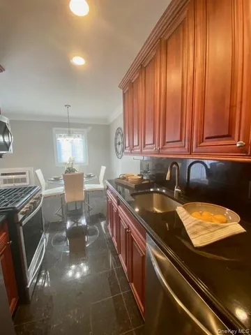 a kitchen with a stove and a sink