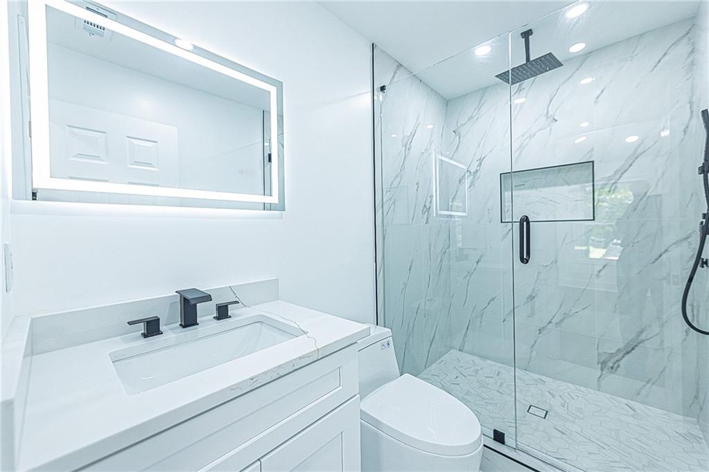 3013 Catalina Drive Decatur, GA 30032 - Photo 19 of 48 a bathroom with a sink toilet and shower