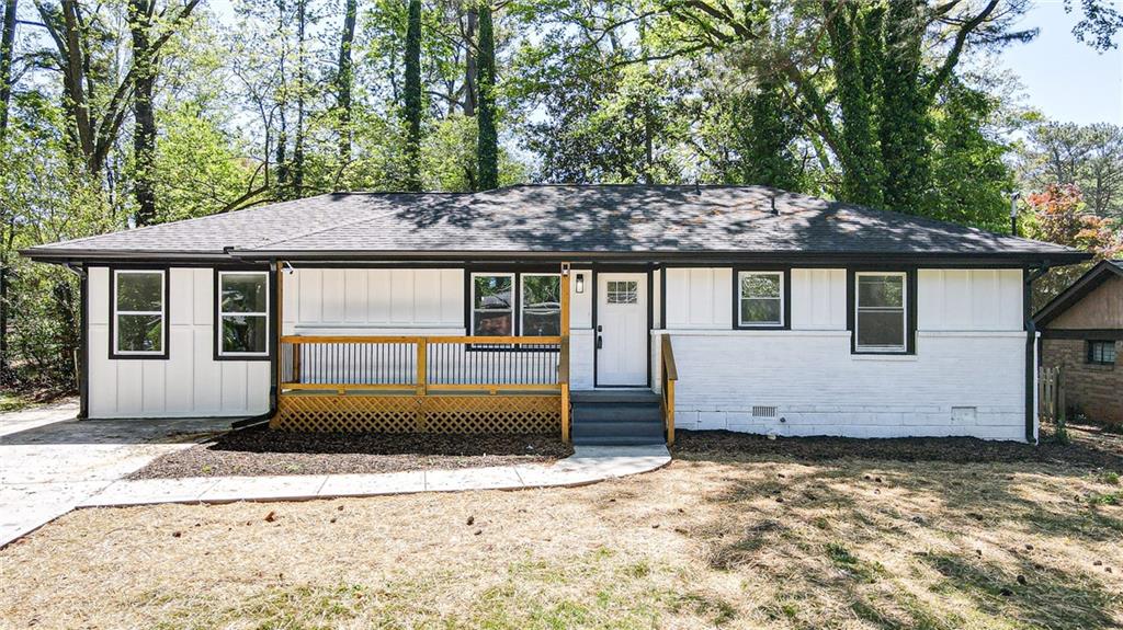 3013 Catalina Drive Decatur, GA 30032 - Photo 2 of 48 a front view of a house with a yard and garage